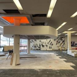 Inside new library entrance, the canopy for the new kiosk location under construction.