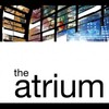 The top half of this square image includes a variety of colourful snippets of different images -- a variety of beiges, burgundies, greens, and blues. The bottom half of the image is has a white background with a black horizontal line at the bottom. Above the black line at the bottom it reads &quot;the atrium.&quot;