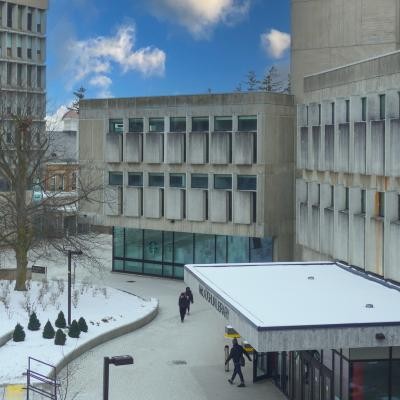 Winter arial shot of the McLaughlin Library entrance with snow cover.